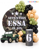 Army camouflage themed birthday party balloon backdrop and jeep decoration
